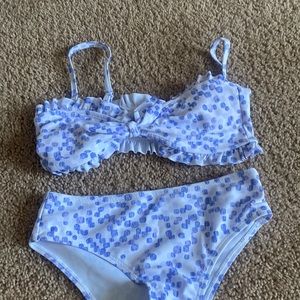 Purple and white ruffled top liner included kids Xs liner